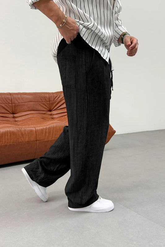 REGULAR FIT PLEATED TENS TROUSERS •  BLACK