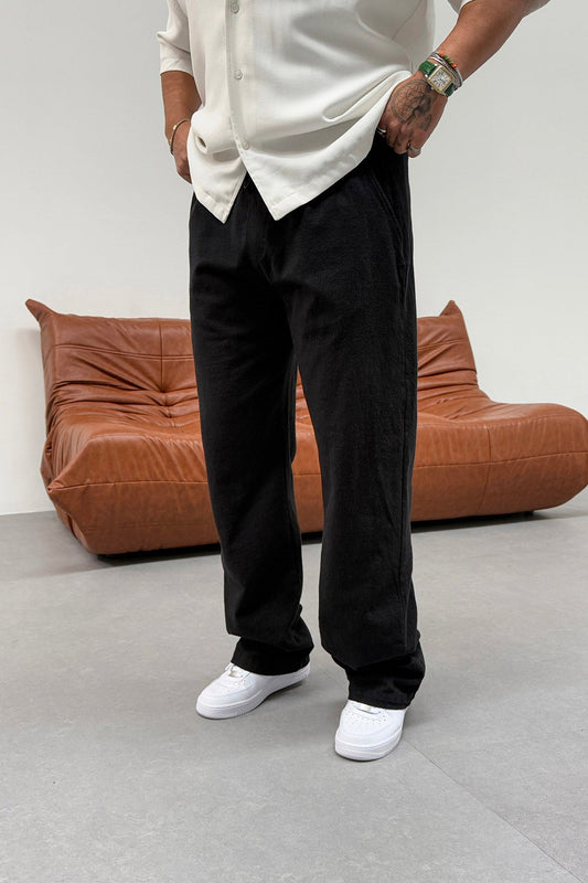 BAGGY PLEATED RAW LINEN TROUSERS | BLACK